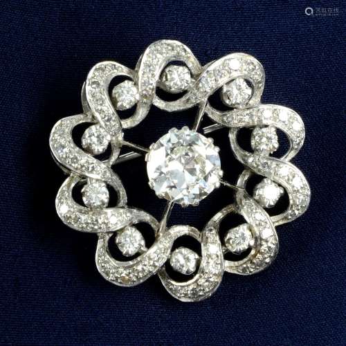 A circular-cut diamond wreath brooch.Principal diamond estim...