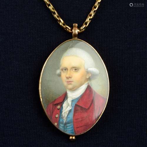 A Georgian portrait miniature locket of a gentleman in a red...