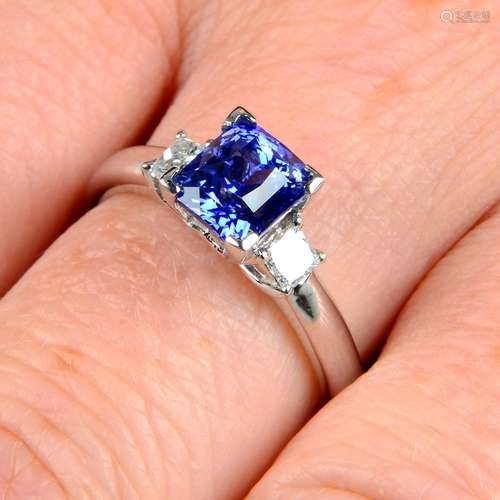 A sapphire and square-shape diamond three-stone ring.Sapphir...