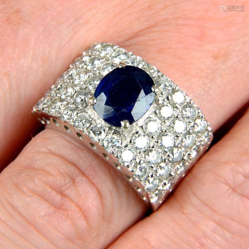 A sapphire and diamond dress ring.Sapphire calculated weight...