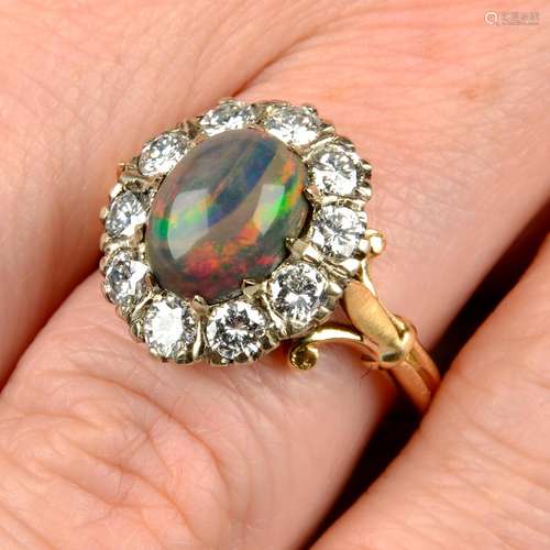 An 18ct gold black opal and diamond cluster ring.