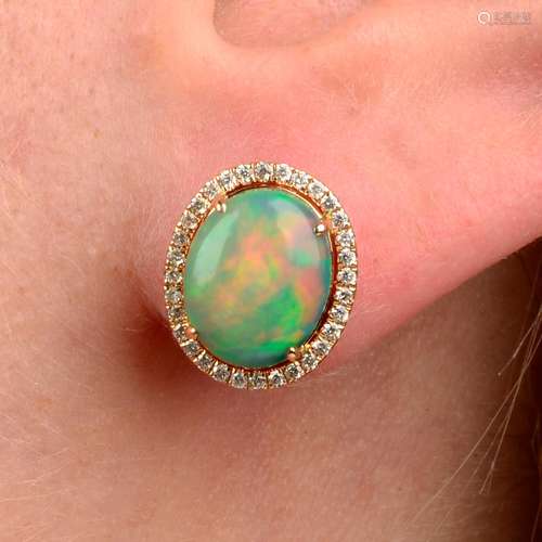 A pair of opal cabochon and brilliant-cut diamond cluster ea...