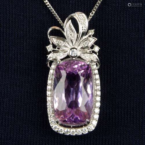 A kunzite and diamond floral pendant.