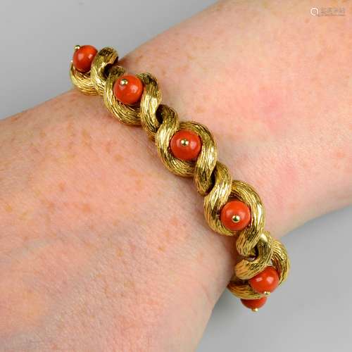 A mid 20th century 18ct gold coral and textured gold bracele...