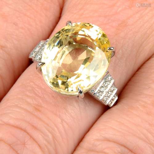 A yellow sapphire and diamond ring.Sapphire weight 15.31cts....