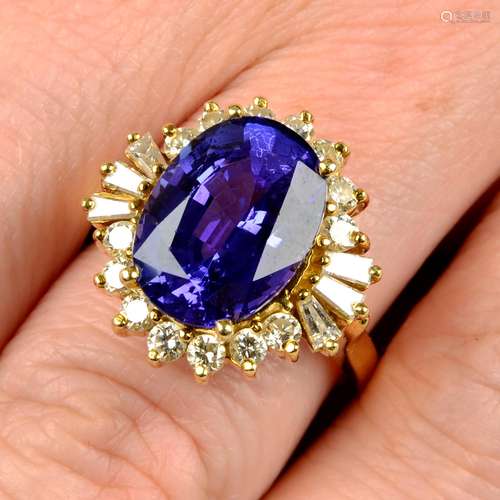 A tanzanite and vari-cut diamond cluster ring.Tanzanite calc...