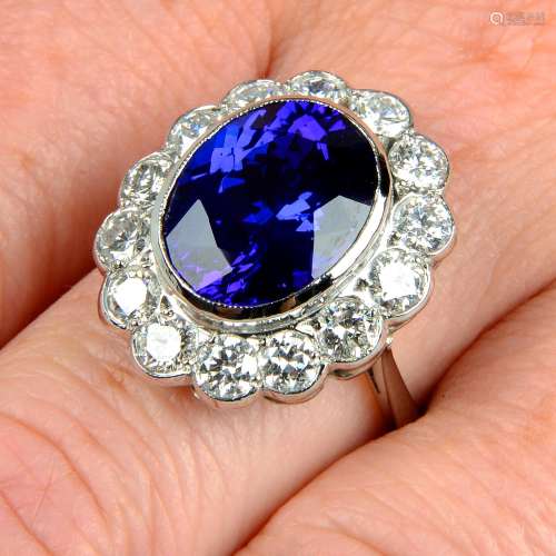 A tanzanite and brilliant-cut diamond cluster ring.Tanzanite...