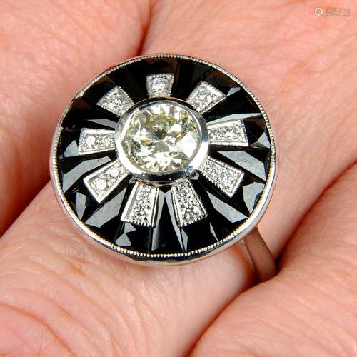 A brilliant-cut diamond and calibré-cut onyx stylised floral...