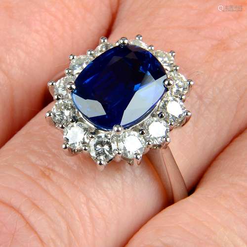 An 18ct gold sapphire and brilliant-cut diamond cluster ring...