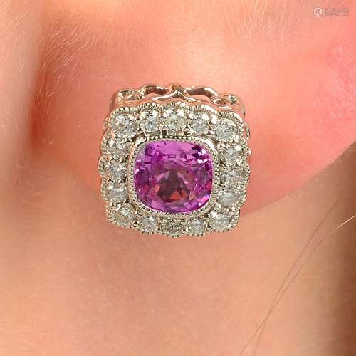 A pair of pink sapphire and diamond cluster earrings.