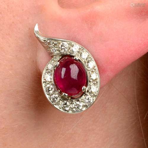 A pair of Burma ruby cabochon and diamond earrings.With repo...