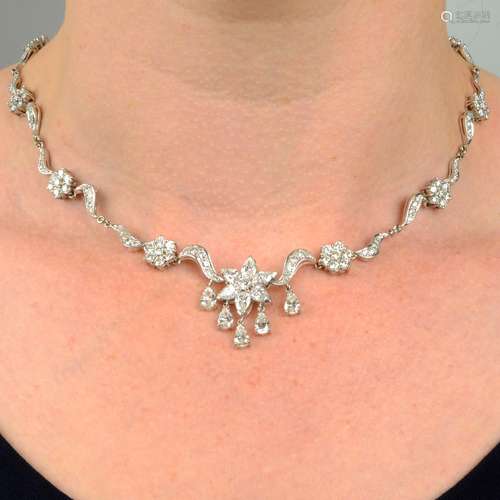 An 18ct gold vari-cut diamond floral necklace.Estimated tota...