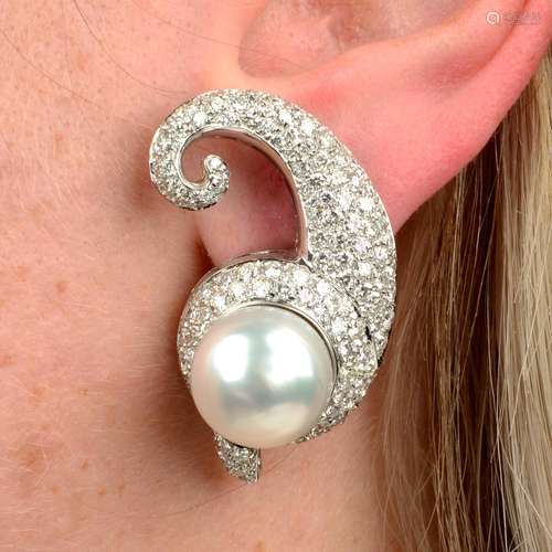 A pair of cultured pearl and pavé-set diamond scroll earring...