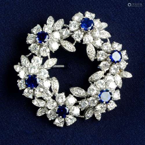 A mid 20th century 18ct gold sapphire and diamond floral wre...