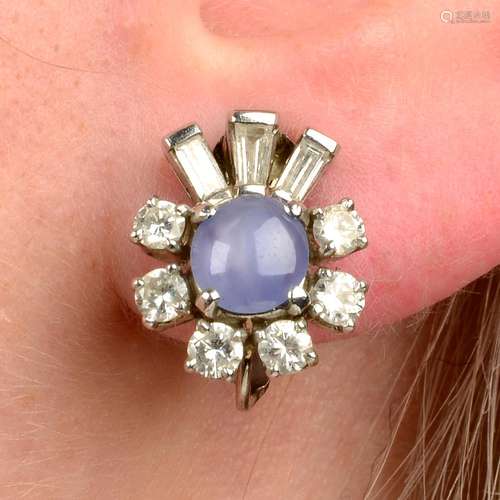 A pair of star sapphire and vari-cut diamond cluster earring...