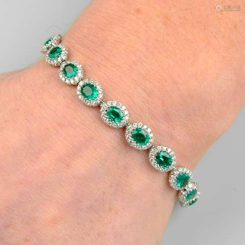 An 18ct gold emerald and diamond cluster link bracelet.Total...