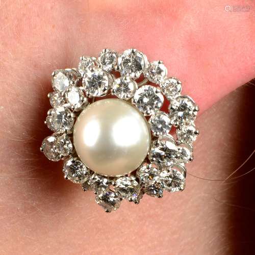 A pair of natural pearl and diamond cluster earrings.With re...