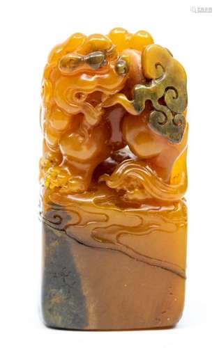 A rare tianhuang stone seal, the top carved with a lion seat...