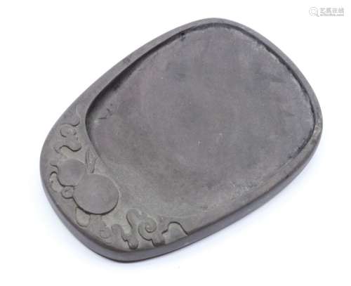 A Chinese carved duan ink stone, of oval form the top carved...