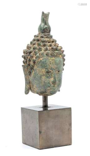 A small Thai bronze head of Buddha, cast with long pendulous...