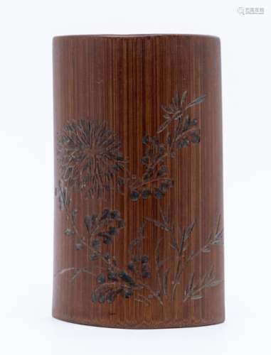A small bamboo wrist rest, 19th century, carved to the upper...