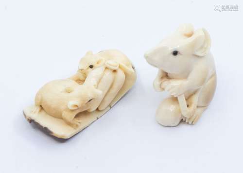 A Japanese ivory netsuke of a mouse, carved with the animal ...
