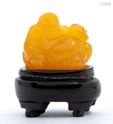 A small loquat tianhuang stone carving of Budai, the figure ...