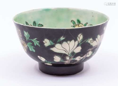 A Chinese famille noire bowl, the exterior painted with bran...
