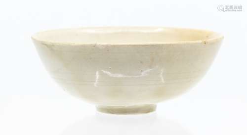 A small Chinese Dingyao ‘lotus’ bowl, the rounded sides risi...