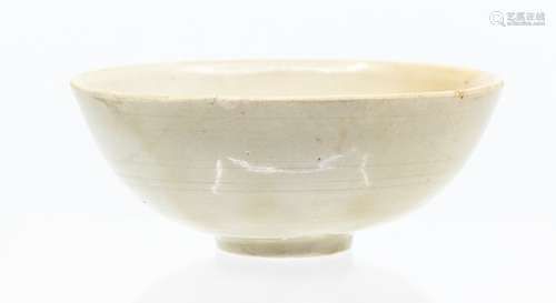 A small Chinese Dingyao ‘lotus’ bowl, the rounded sides risi...