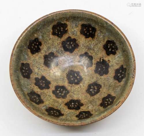 A Chinese Jizhou papercut bowl, of conical form, the interio...