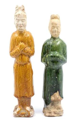 A pair of glazed Chinese pottery figures, each figure standi...