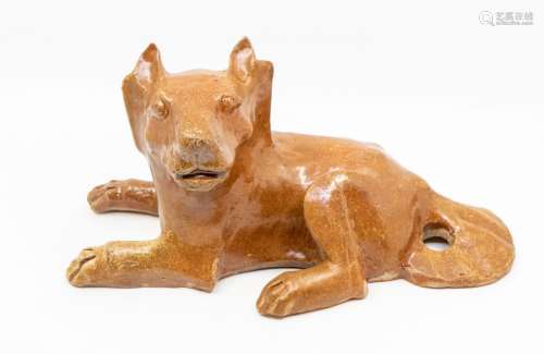 A Chinese brown glazed pottery figure of a dog, the animal r...
