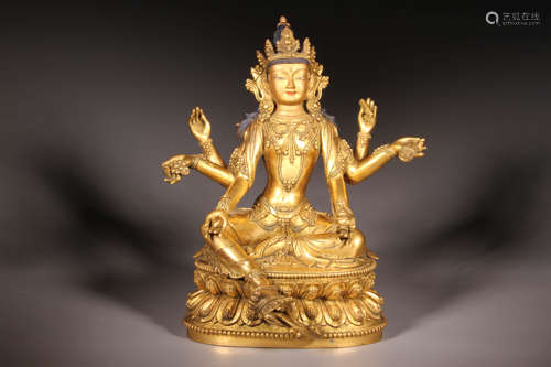 A Gilt Bronze Six-Arm Steated Guanyin