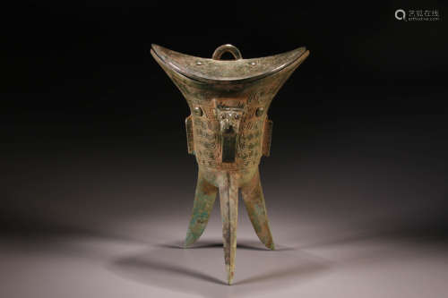 A Chinese Bronze Three Feet Cup