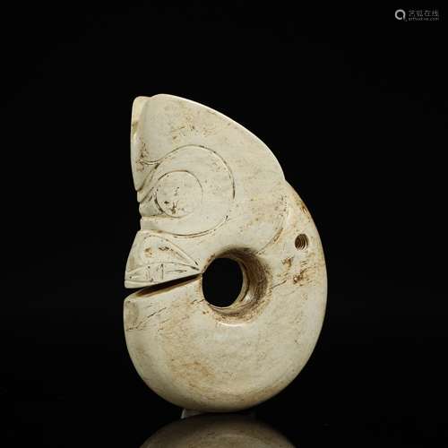 A CELADON AND RUSSET JADE 'PIG DRAGON' CARVING NEOLITHIC PER...