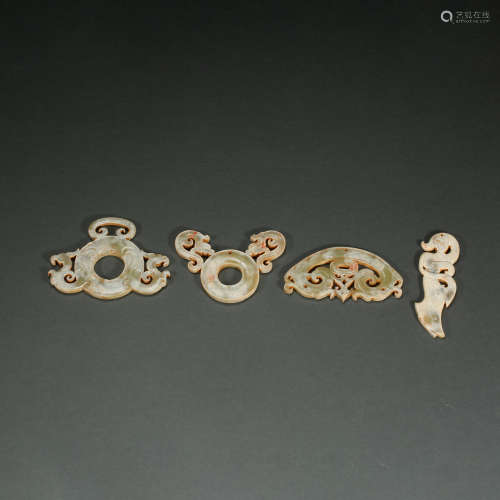A GROUP OF CHINESE HAN DYNASTY HETIAN JADE ACCESSORIES