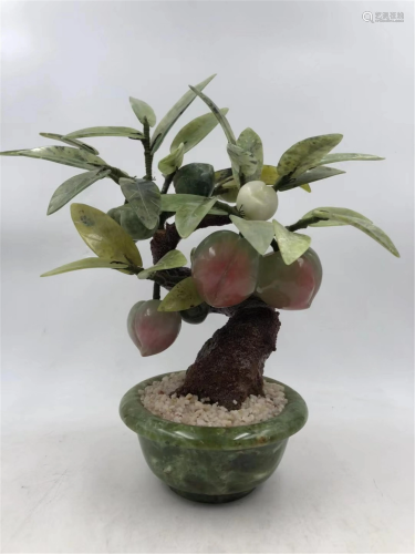 A CHINESE PEACH POTTED LANDSCAPE