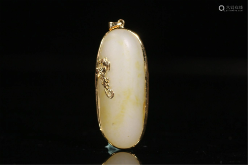 A CHINESE HARDJADE SEED MATERIAL PENDANT COVERED WITH