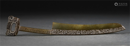 A CHINESE JADE KNIFE-SHAPED COIN