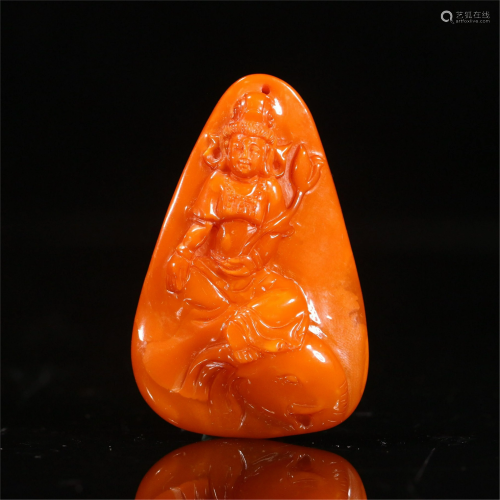 A CHINESE CARVED GUANYIN AMBER PENDANT