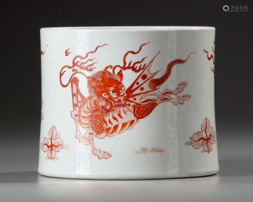 A CHINESE IRON-RED 'MYTHICAL BEAST' BRUSH POT, BITONG, QING ...