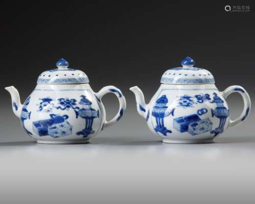 A PAIR OF SMALL CHINESE BLUE AND WHITE TEAPOTS AND COVERS, K...