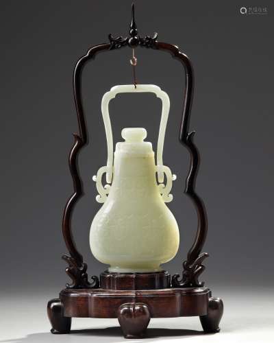 A CHINESE PALE JADE HANGING VASE WITH COVER AND HARDWOOD STA...