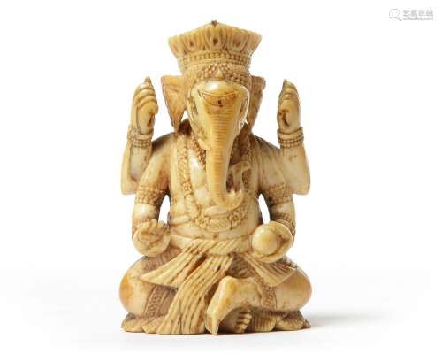 AN INDIAN IVORY SEATED GANESHA,17TH CENTURY