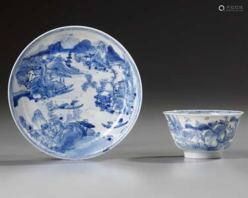 A CHINESE BLUE AND WHITE 'MASTER OF THE ROCKS' CUP AND SAUCE...