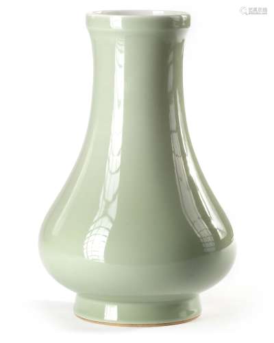 A CHINESE CELADON-GLAZED CARVED PEAR-SHAPED VASE