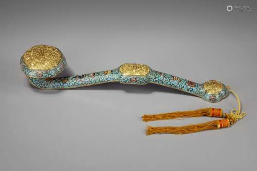 A CHINESE CLOISONNÉ ENAMEL RUYI-SCEPTRE IN A JADE PLAQUE INS...