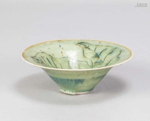 KATSUJI TANIGUCHI; a porcelain bowl covered in pale green gl...