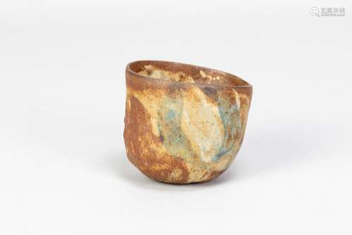 JOHN DAN (1930-1983); a small stoneware vessel with iron and...